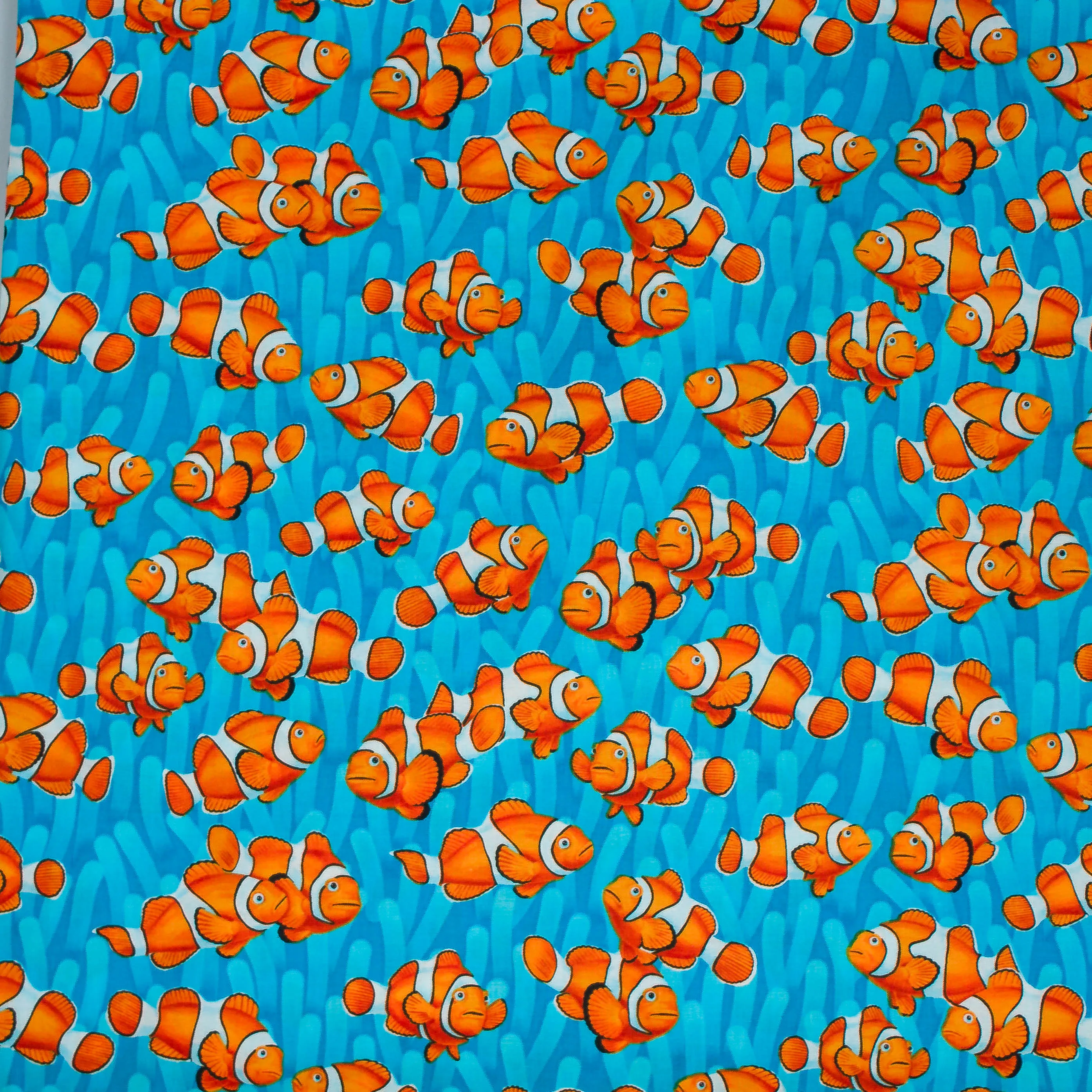 Katoen blauw met getekende clownvissen